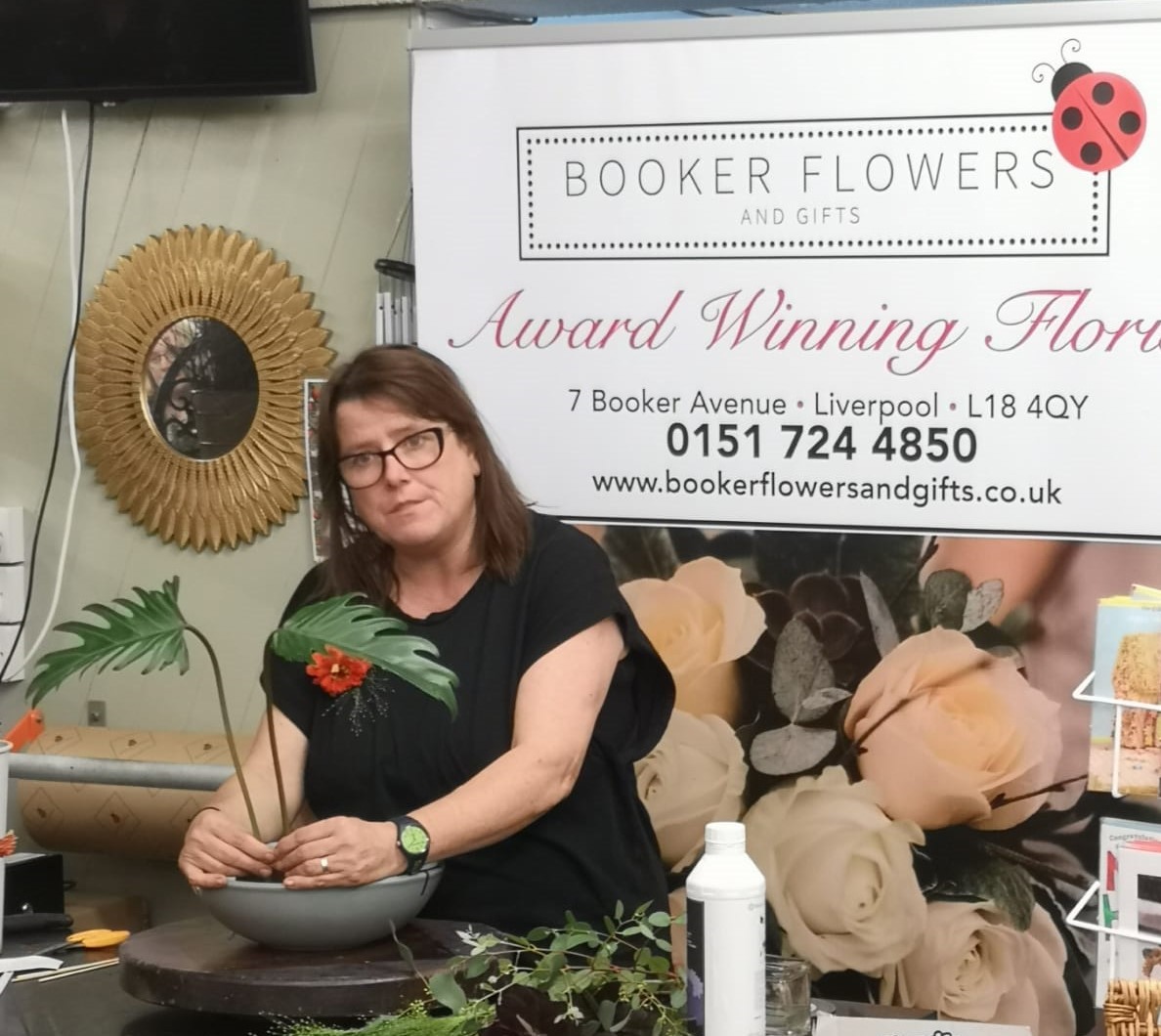 Fleur from Booker Flowers demonstrating how to make an Autumn Arrangement